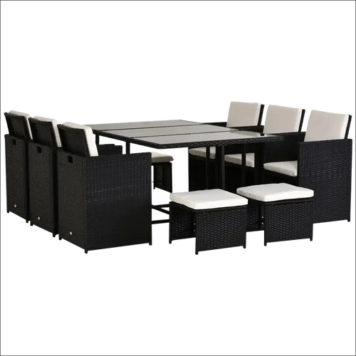 Conjunto de jardín con cojines de ratán negro y mesa de cristal