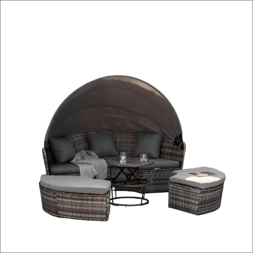 Cama de día redonda de mimbre gris con dosel curvo y cojines a juego