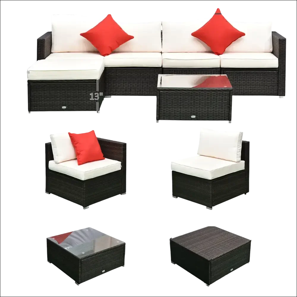 Juego de muebles de patio de mimbre negro con cojines blancos y almohadas rojas