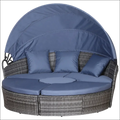 Mobiliario de jardín de ratán gris redondo con toldo azul retráctil